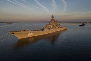 FILE - In this Saturday, July 29, 2017 file aerial photo, the Russian nuclear-powered cruiser Pyotr Veliky (Peter the Great) and the Russian nuclear submarine Dmitry Donskoy moored near Kronstadt, a seaport town 30 km (19 miles) west of St. Petersburg, Russia.