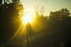 A Ukrainian serviceman walks along the road near Oskil village, Ukraine, Thursday, Oct. 6, 2022.