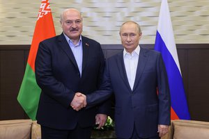 Russian President Vladimir Putin, right, and Belarusian President Alexander Lukashenko pose for a photo prior to their talks in the Bocharov Ruchei residence in the Black Sea resort of Sochi, Russia, Monday, Sept. 26, 2022