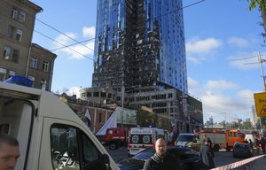 Police block the scene of Russian shelling in Kyiv, Ukraine, Monday, Oct. 10, 2022. Two explosions rocked Kyiv early Monday following months of relative calm in the Ukrainian capital. (AP Photo/Efrem Lukatsky)