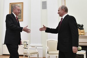 Russian President Vladimir Putin, right, greets Turkey's President Recep Tayyip Erdogan in the Kremlin in Moscow, Russia, Wednesday, Jan. 23, 2019. (Alexander Nemenov/Pool Photo via AP)