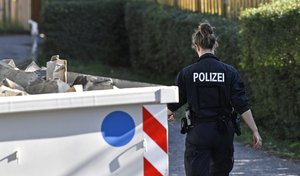 Germany police officers search an allotment garden plot in Seelze, near Hannover, Germany, Wednesday, July 29, 2020