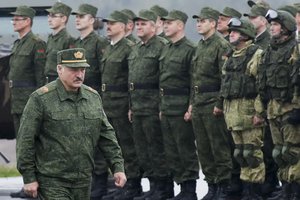 File - Belarusian President Alexander Lukashenko inspects the troops during the Zapad (West) 2017 joint Russia-Belarus military drills at the Borisovsky range in Borisov, Belarus, Wednesday, Sept. 20, 2017. Lukashenko this week once again accused Ukraine of planning to attack it and announced creating a joint grouping of troops with Moscow, a move that stocked fears that Belarusian army could join Russian forces in Ukrainian trenches.