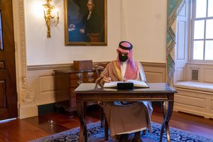 Saudi Foreign Minister Prince Faisal bin Farhan Al Saud signs Secretary of State Michael R. Pompeo's guestbook before their bilateral meeting at the U.S. Department of State in Washington, D.C., on October 14, 2020.