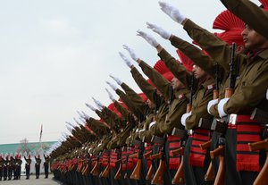 New recruits of the Jammu Kashmir Light Infantry Regiment (JKLIR)take oath during a passing out parade at an army base in Srinagar Saturday on 05, April 2014. Some 311 recruits were formally inducted into the Army's JKLIR after completing 49 weeks of training.