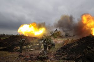 Servicemen fire from their 152-mm gun 2A36 «Giatsint-B» howitzer from their position at Ukrainian troops at an undisclosed location in Donetsk People's Republic, eastern Ukraine, Tuesday, Oct. 11, 2022