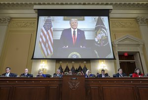 A video of then-President Donald Trump speaking is displayed as the House select committee investigating the Jan. 6 attack on the U.S. Capitol holds a hearing on Capitol Hill in Washington, Thursday, Oct. 13, 2022