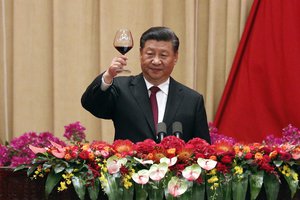 Chinese President Xi Jinping makes a toast after delivering his speech at a dinner marking the 70th anniversary of the founding of the People's Republic of China at the Great Hall of the People in Beijing, Monday, Sept. 30, 2019.