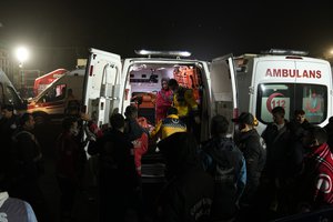 Rescuers load a body of a victim in an ambulance in front of the state-owned TTK Amasra Muessese Mudurlugu mine in Amasra, in the Black Sea coastal province of Bartin, Turkey, Saturday, Oct. 15, 2022