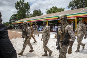 Leader of Mali's ruling junta Lt. Col. Assimi Goita, center, attends an independence day military parade in Bamako, Mali Thursday, Sept. 22, 2022