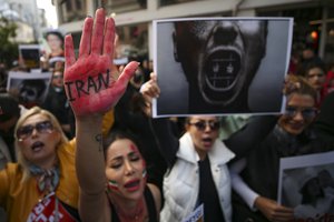 Iranian women shout slogans to protest over the death of Mahsa Amini during a demonstration outside the Iranian consulate in Istanbul, Turkey, Monday, Oct. 17, 2022.