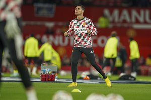 Manchester United's Cristiano Ronaldo warms up ahead of the English Premier League soccer match between Manchester United and Tottenham Hotspur at Old Trafford in Manchester, England, Wednesday, Oct. 19, 2022.