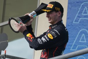 Red Bull driver Max Verstappen, of the Netherlands, raises the trophy after winning the Formula One U.S. Grand Prix auto race at Circuit of the Americas, Sunday, Oct. 23, 2022, in Austin, Texas