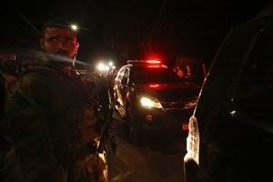 A Federal Police vehicle moves former lawmaker Roberto Jefferson after he was detained, from his house in Levy Gasparian, Rio de Janeiro state, Brazil, Sunday, Oct. 23, 2022