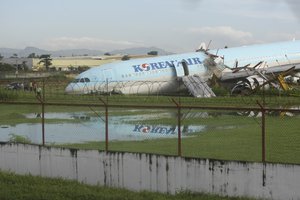 A damaged Korean Air plane sits after it overshot the runway at the Mactan-Cebu International Airport in Cebu, central Philippines early Monday Oct. 24, 2022