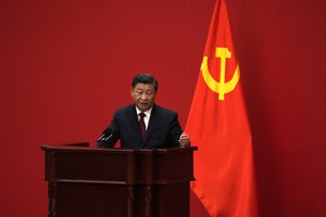 Chinese President Xi Jinping speaks at an event to introduce new members of the Politburo Standing Committee at the Great Hall of the People in Beijing, Sunday, Oct. 23, 2022