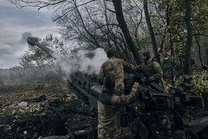 Ukrainian soldiers fire at Russian positions from a U.S.-supplied M777 howitzer in Ukraine's eastern Donetsk region Sunday, Oct. 23, 2022