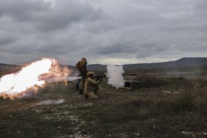 A recruit fires a Russian man-portable missile during a military training at a firing range in the Krasnodar region in southern Russia, Oct. 21, 2022