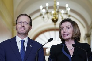 Speaker of the House Nancy Pelosi, D-Calif., right and Israeli President Isaac Herzog, left, talk to reporters Tuesday, Oct. 25, 2022, on Capitol Hill in Washington.