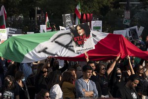 Demonstrators march on the streets to protest against the Iranian regime, in Washington, Saturday, Oct. 22, 2022, following the death of Mahsa Amini in the custody of the Islamic republic's notorious "morality police."