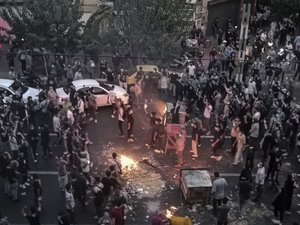 File - Iranians protest a 22-year-old woman Mahsa Amini's death after she was detained by the morality police, in Tehran, Sept. 20, 2022, in this photo taken by an individual not employed by the Associated Press and obtained by the AP outside Iran.