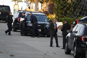 Police investigators work outside the home of House Speaker Nancy Pelosi and her husband Paul Pelosi in San Francisco, Friday, Oct. 28, 2022