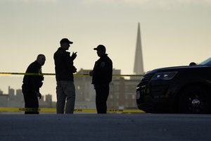 Police stand at the top of the closed street outside the home of House Speaker Nancy Pelosi and her husband Paul Pelosi in San Francisco, Friday, Oct. 28, 2022