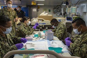 SAN DIEGO (Feb. 3, 2021) Sailors prepare syringes of the Pfizer COVID-19 vaccine aboard Wasp-class amphibious assault ship USS Essex (LHD 2).