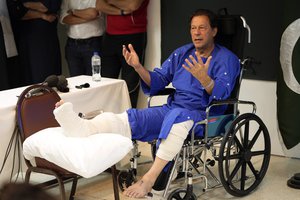 Former Pakistani Prime Minister Imran Khan speaks during a news conference in Shaukat Khanum hospital, where is being treated for a gunshot wound in Lahore, Pakistan, Friday, Nov. 4, 2022.