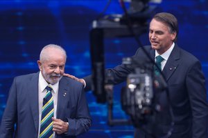 Lula da Silva, who is running for office again, left, faces Jair Bolsonaro in a presidential debate