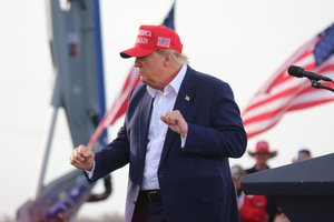 President Donald J. Trump dances at the conclusion of a rally in Greenwood, Neb.