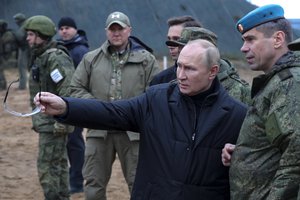 File - Russian President Vladimir Putin, second right, gestures as he visits with Deputy Commander of the Airborne Troops Anatoly Kontsevoy, right, a military training centre of the Western Military District for mobilised reservists in Ryazan Region, Russia, on Oct. 20, 2022. Russia’s military has announced that it’s withdrawing from Ukraine's southern city of Kherson and nearby areas.