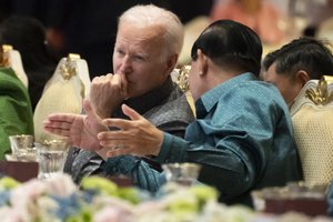 U.S. President Joe Biden, left, and Cambodian Prime Minister Hun Sen talk as they watch a cultural dance performance at the Association of Southeast Asian Nations (ASEAN) gala dinner, Saturday, Nov. 12, 2022, in Phnom Penh, Cambodia.