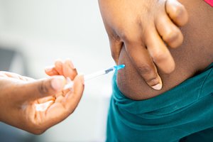 A person getting vaccinated against COVID-19 in the  Red Cross Village of Ronquières, Belgium