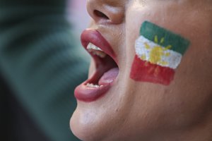 An Iranian woman shouts slogans during a demonstration outside the Iranian consulate in Istanbul, Saturday, Oct. 22, 2022