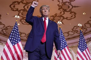 Former President Donald Trump gestures after announcing he is running for president for the third time as he speaks at Mar-a-Lago in Palm Beach, Tuesday, Nov. 15, 2022