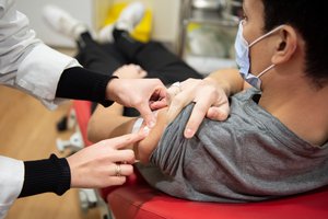 A person who has just been vaccinated against influenza at Air France's international vaccination centre