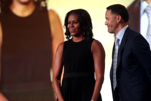 Former First Lady of the United States Michelle Obama and Steve Pemberton speaking with attendees at the 2017 WorkHuman conference at the JW Marriott Phoenix Desert Ridge Resort & Spa in Phoenix, Arizona