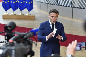 French President Emmanuel Macron speaks to media after the second day's session of an extraordinary meeting of EU leaders to discuss Ukraine, energy and food security at the Europa building in Brussels, Tuesday, May 31, 2022