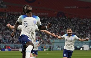 England's Bukayo Saka celebrates after scoring his side's second goal during the World Cup group B soccer match between England and Iran at the Khalifa International Stadium in Doha, Qatar, Monday, Nov. 21, 2022