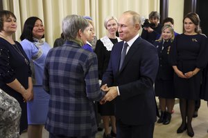 Russian President Vladimir Putin attends a meeting with mothers of military personnel serving in the special military operation ahead of Mother's Day at the Novo-Ogaryovo residence outside Moscow, Russia, Friday, Nov. 25, 2022.