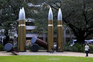 A family play at a art installation in Hyde Park in central Sydney, Australia, Wednesday, May 4, 2022