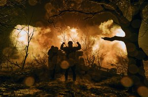 Ukrainian soldiers fire an artillery at Russian positions near Bakhmut, Donetsk region, Ukraine, Sunday, Nov. 20, 2022.