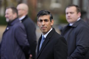 Britain's Prime Minister Rishi Sunak walks to the Ceremonial Welcome for the President of South Africa Cyril Ramaphosa at Horse Guards Parade in London, Tuesday, Nov. 22, 2022.