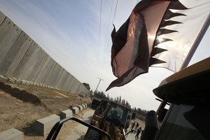 Equipment and heavy machinery arrive to Gaza for the first time through the Rafah border crossing with Egypt dedicated to the Qatari project for the reconstruction of the Gaza Strip, on March 21, 2013. Indirect talks between Israel and Gaza-rulers Hamas, held earlier this year, included opening the Rafah crossing on Gaza's border with Egypt to enable the transfer of construction materials from Qatar, as well as enabling agricultural produce from Gaza to enter Israel. Photo by Ahmed Deeb / WN