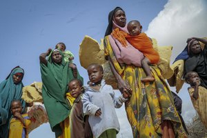 File: Somalis who fled drought-stricken areas carry their belongings as they arrive at a makeshift camp for the displaced on the outskirts of Mogadishu, Somalia, Thursday, June 30, 2022. The war in Ukraine has abruptly drawn millions of dollars away from longer-running humanitarian crises and Somalia is perhaps the most vulnerable as thousands die of hunger amid the driest drought in decades.