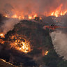 A firefighting helicopter tackling a bushfire near Bairnsdale in Victoria’s East Gippsland in December 2019.