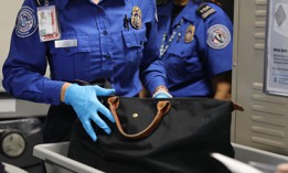 A Transportation Security Administration (TSA) worker screens luggage at LaGuardia Airport on September 26, 2017 in New York City. 