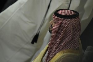 Crown Prince and Prime Minister of Saudi Arabia Mohammed bin Salman Al Saud waits for the start of the World Cup group A soccer match between Qatar and Ecuador at the Al Bayt Stadium in Al Khor, Qatar, Sunday, Nov. 20, 2022. (AP Photo/Hassan Ammar)