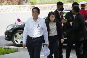 Japanese Prime Minister Fumio Kishida arrive as they visit a mangrove seeding area as part of the G20 Summit in Denpasar, Bali, Indonesia, on Wednesday Nov. 16, 2022